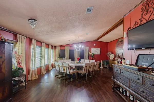 a view of a dining room with furniture window and wooden floor