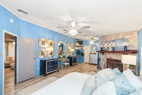 a bed room with a bed and a television