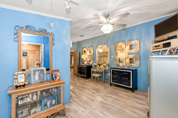 a view of living room kitchen with furniture and flat screen tv