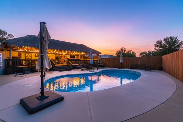 a view of a swimming pool with a patio