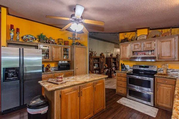 a kitchen that has a stove and a refrigerator
