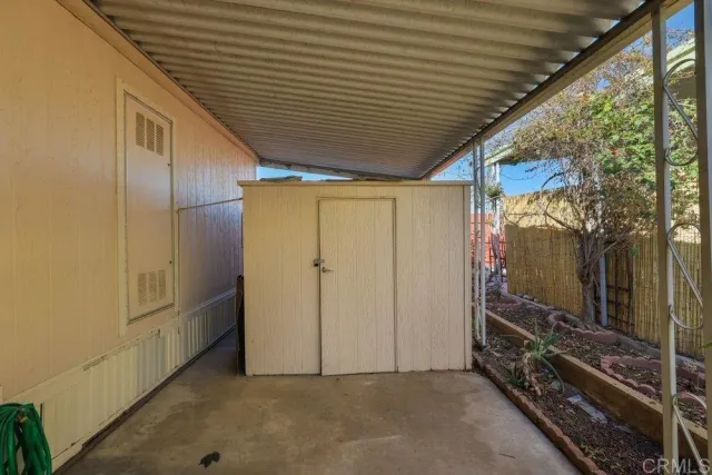 a view of a backyard with palm trees