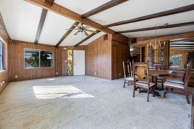 a view of a livingroom with furniture and a garage
