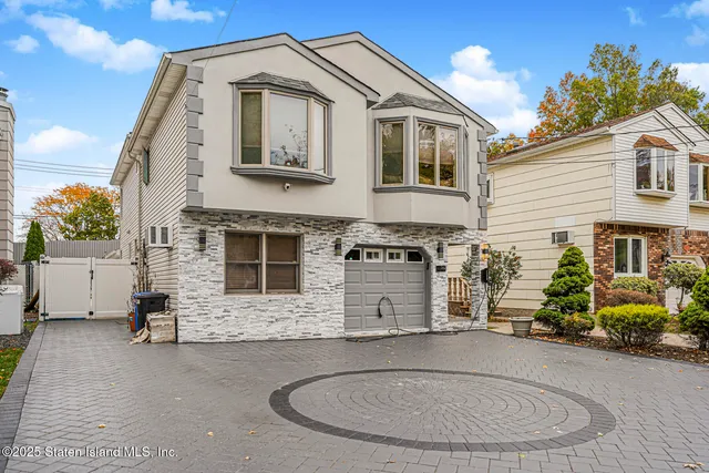 a view of a house with a small yard