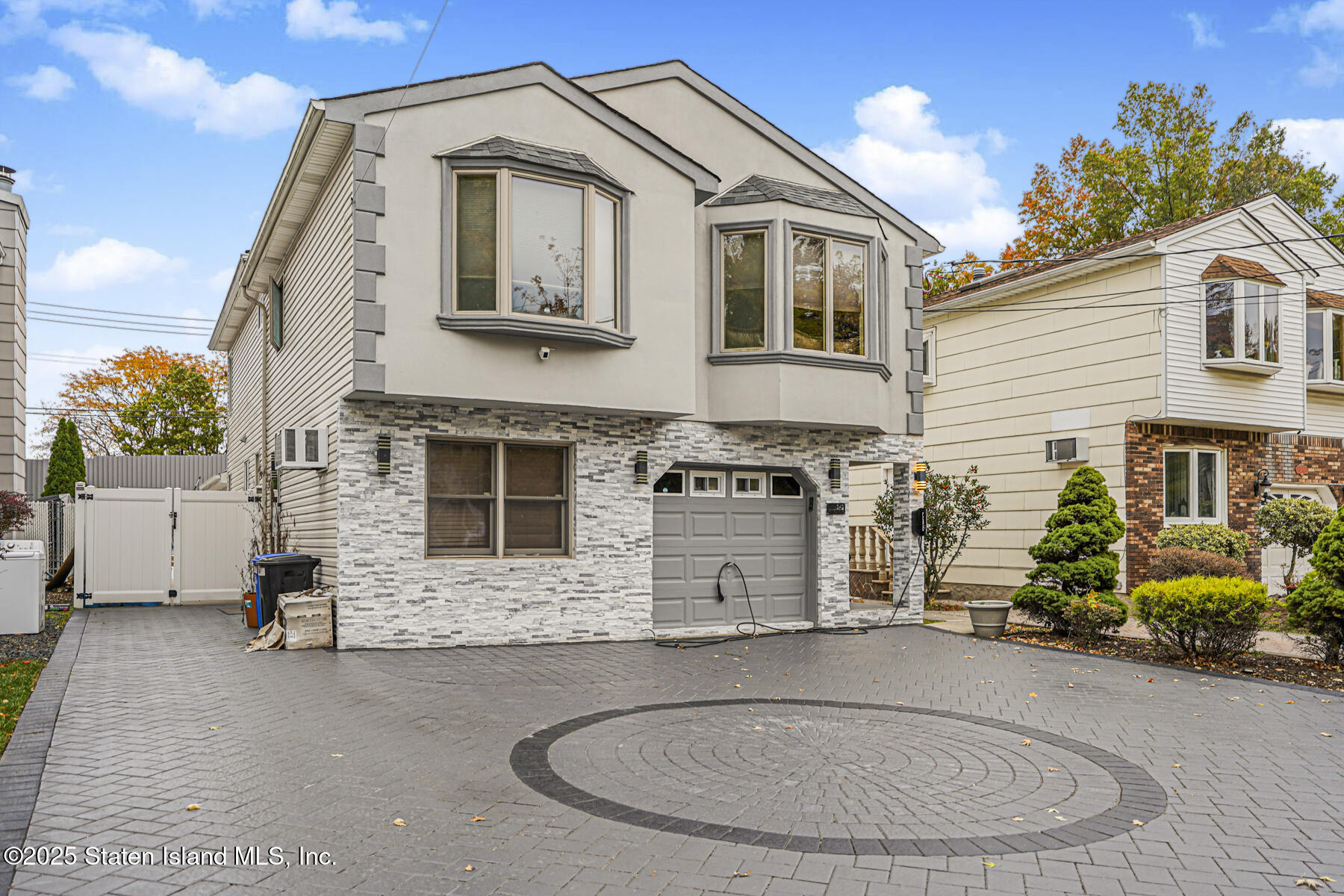 a view of a house with a small yard