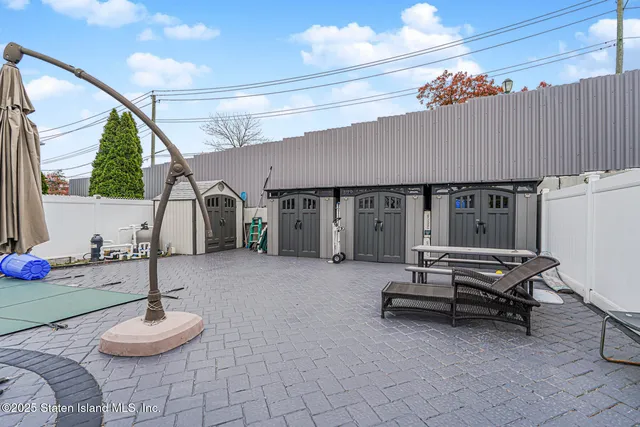 a bedroom with furniture and a chair