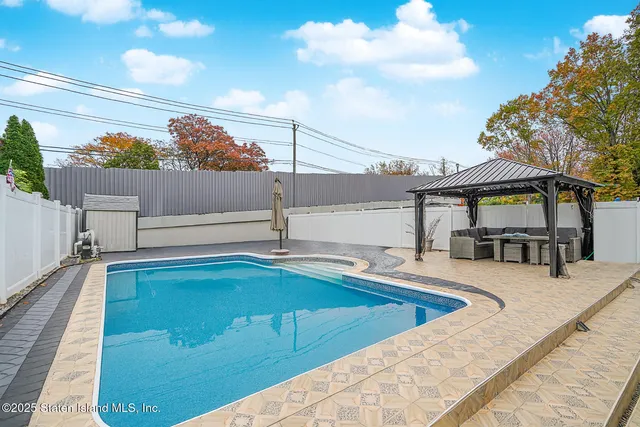 a view of a balcony with chairs
