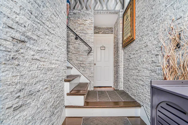a view of entryway with wooden floor