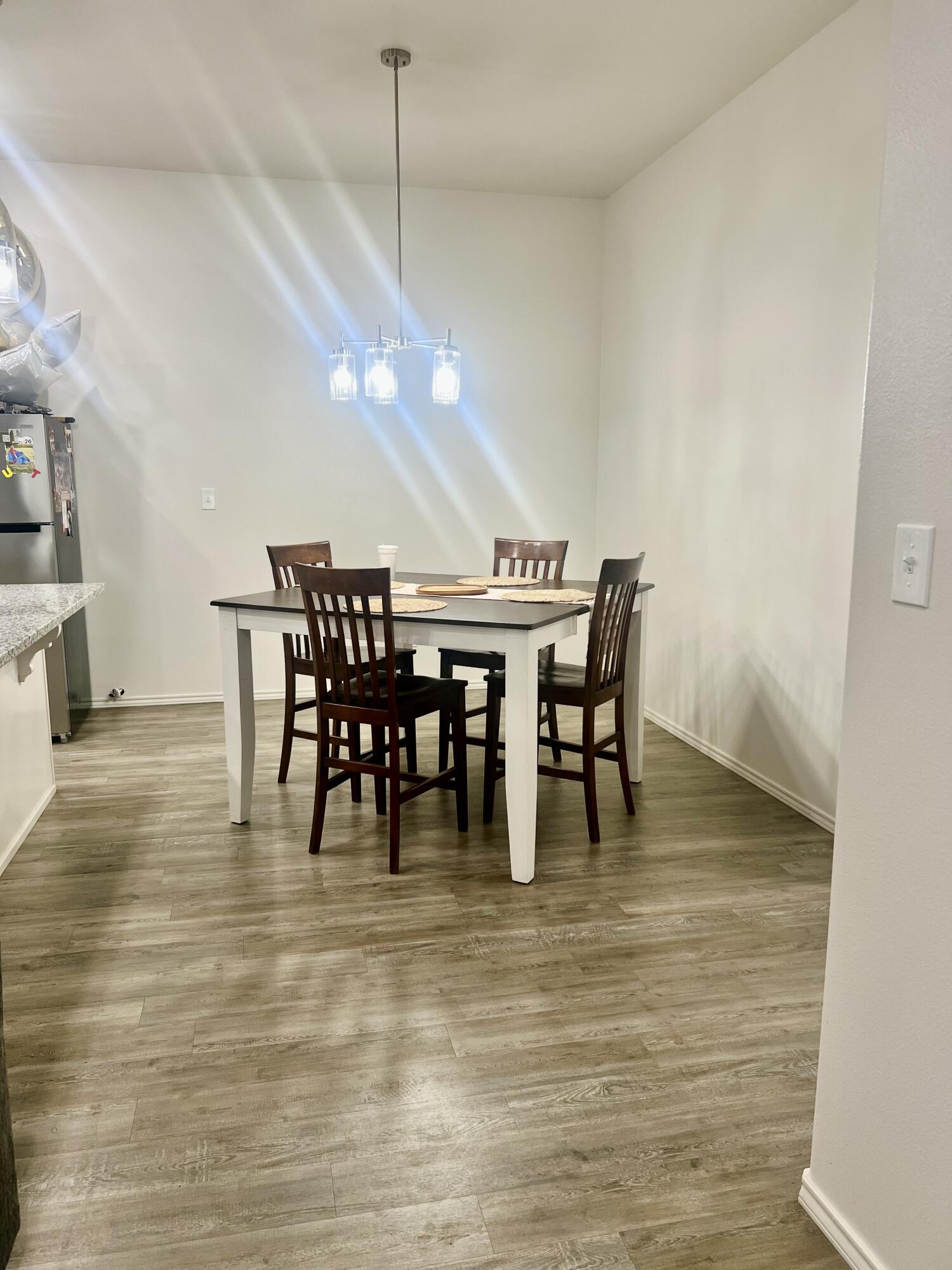 5615 Kemper Street Lubbock, TX 79416 - Photo 3 of 6 a view of a dining room with furniture