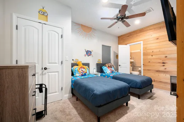 a bedroom with furniture and a window