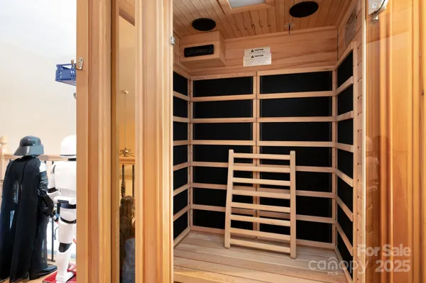 a view of walk in closet and bedroom view