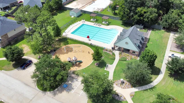 an aerial view of a house with outdoor space