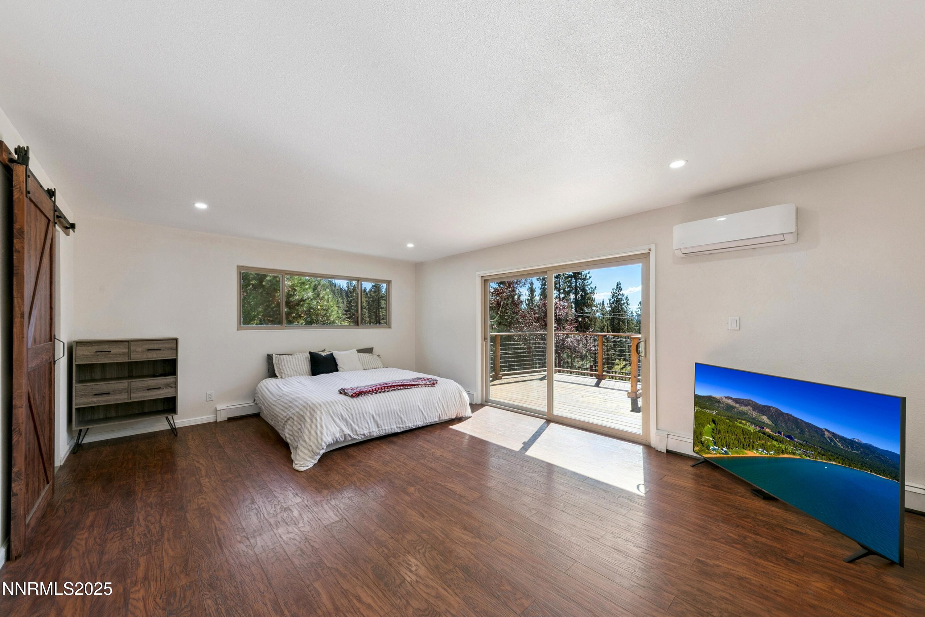 207 Cedar Ridge Drive Zephyr Cove, NV 89448 - Photo 12 of 26 a living room with furniture and large windows