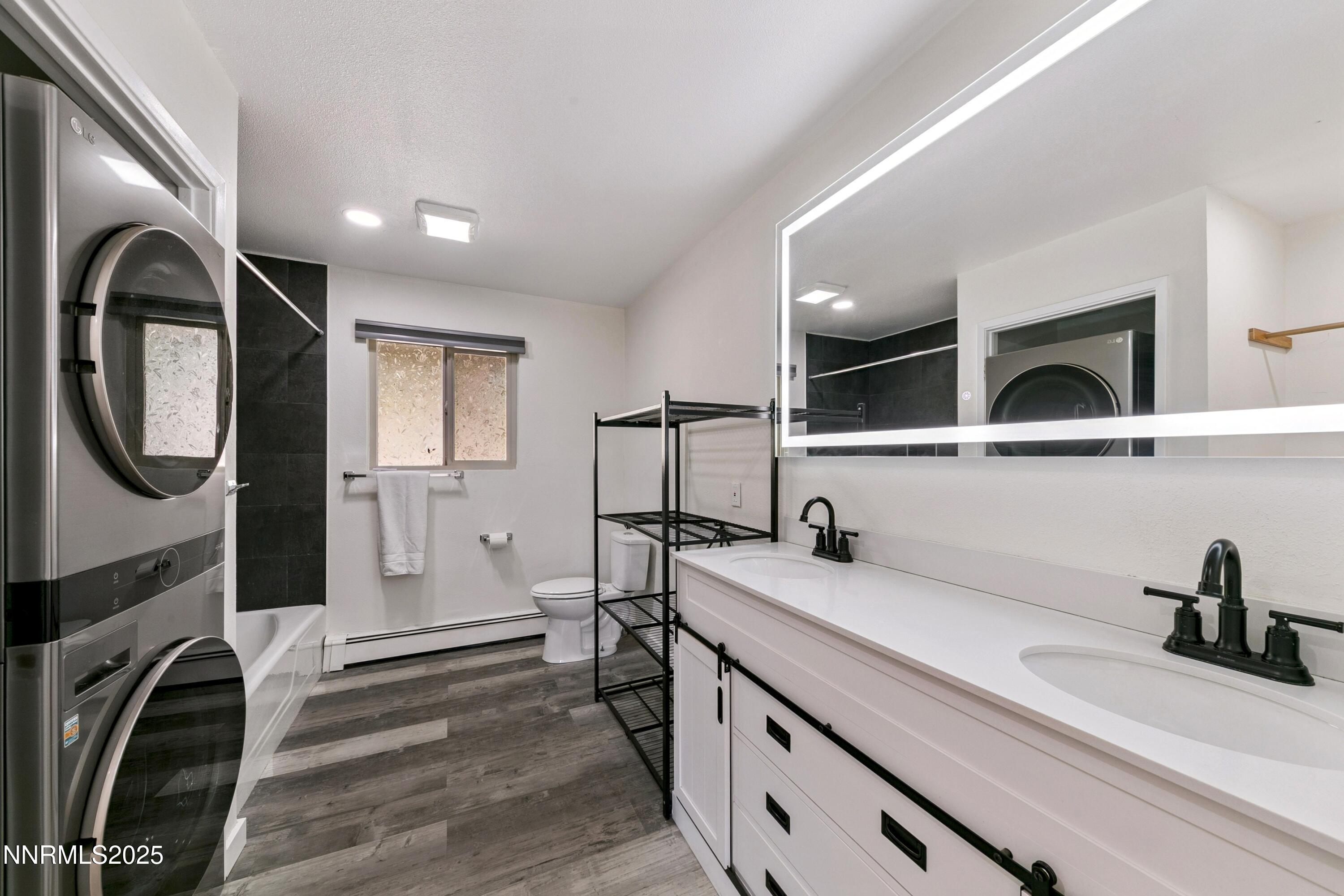 207 Cedar Ridge Drive Zephyr Cove, NV 89448 - Photo 13 of 26 a view of a hallway with washer and dryer