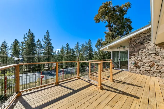 a view of balcony with deck and wooden floor