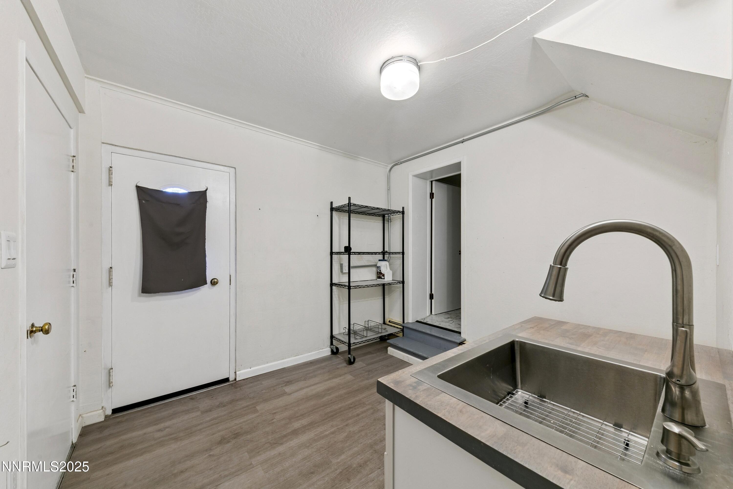 207 Cedar Ridge Drive Zephyr Cove, NV 89448 - Photo 18 of 26 a kitchen with a sink and a refrigerator