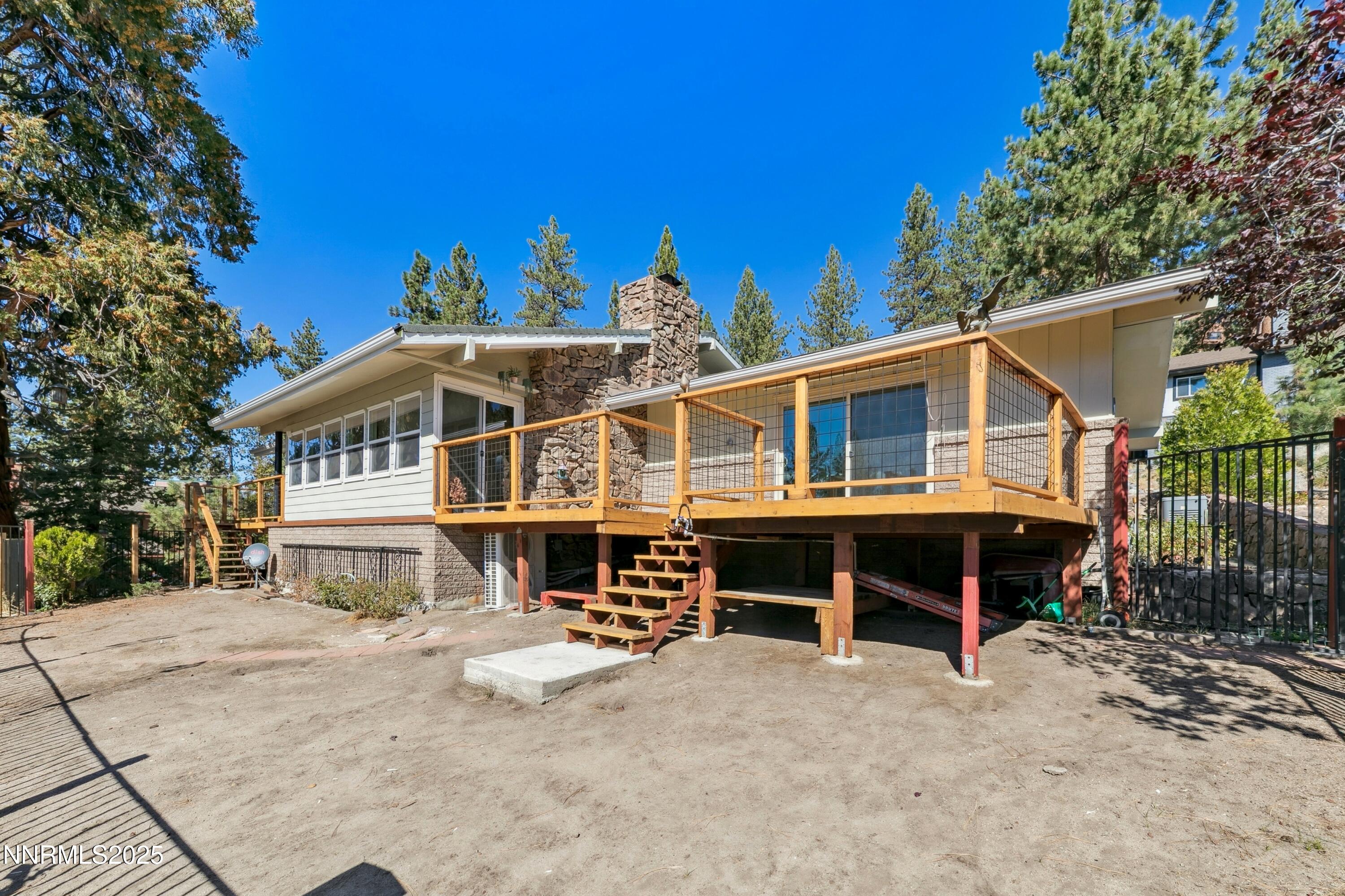 207 Cedar Ridge Drive Zephyr Cove, NV 89448 - Photo 26 of 26 a view of house with a yard and wooden fence