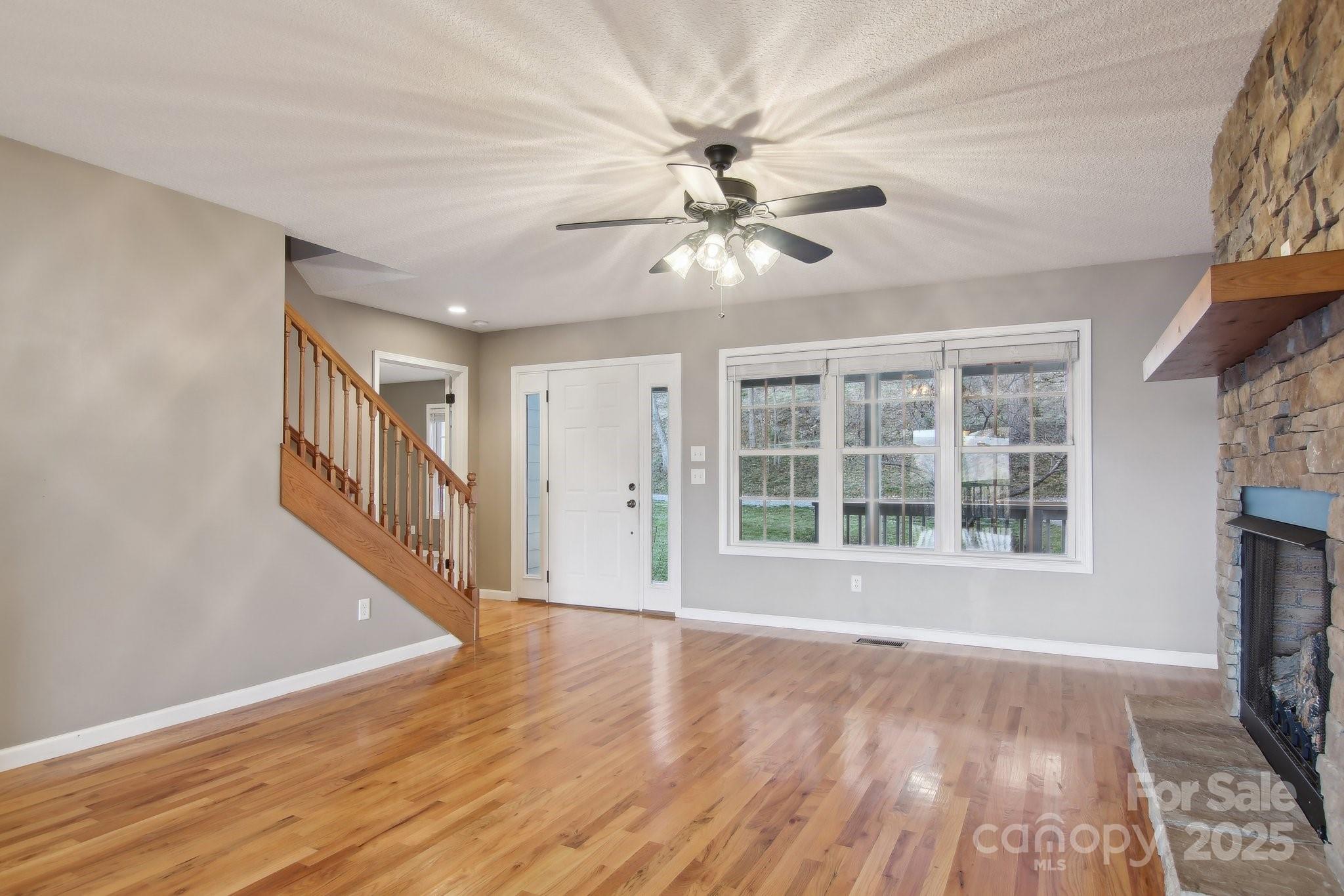 76 Eastern Sky Drive Canton, NC 28716 - Photo 14 of 48 a view of an empty room with wooden floor and a window
