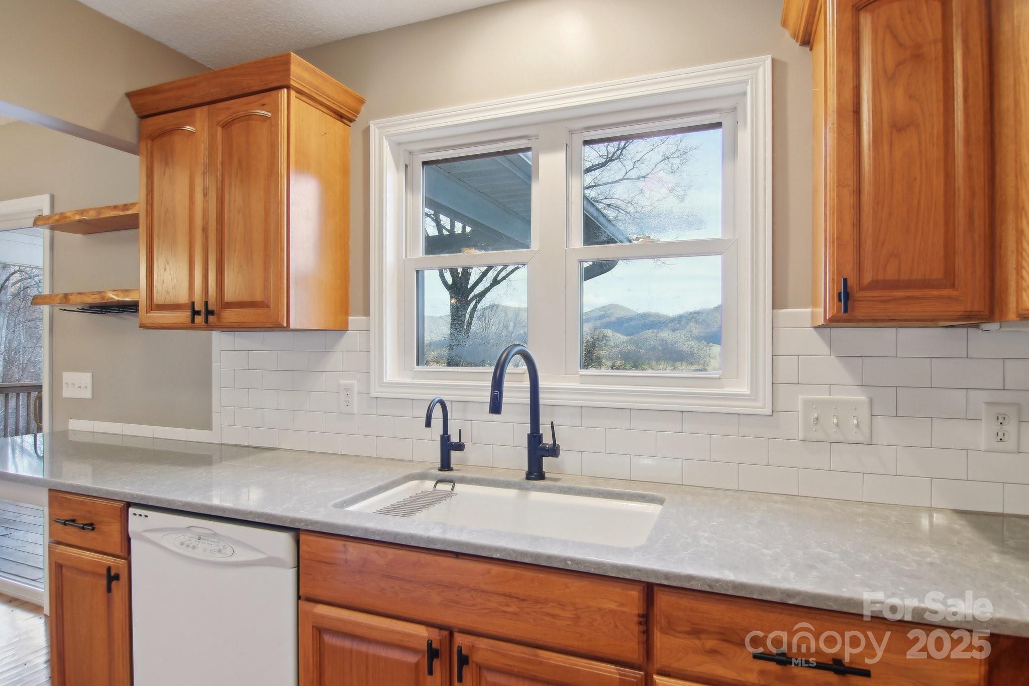76 Eastern Sky Drive Canton, NC 28716 - Photo 21 of 48 a bathroom with a sink and a window