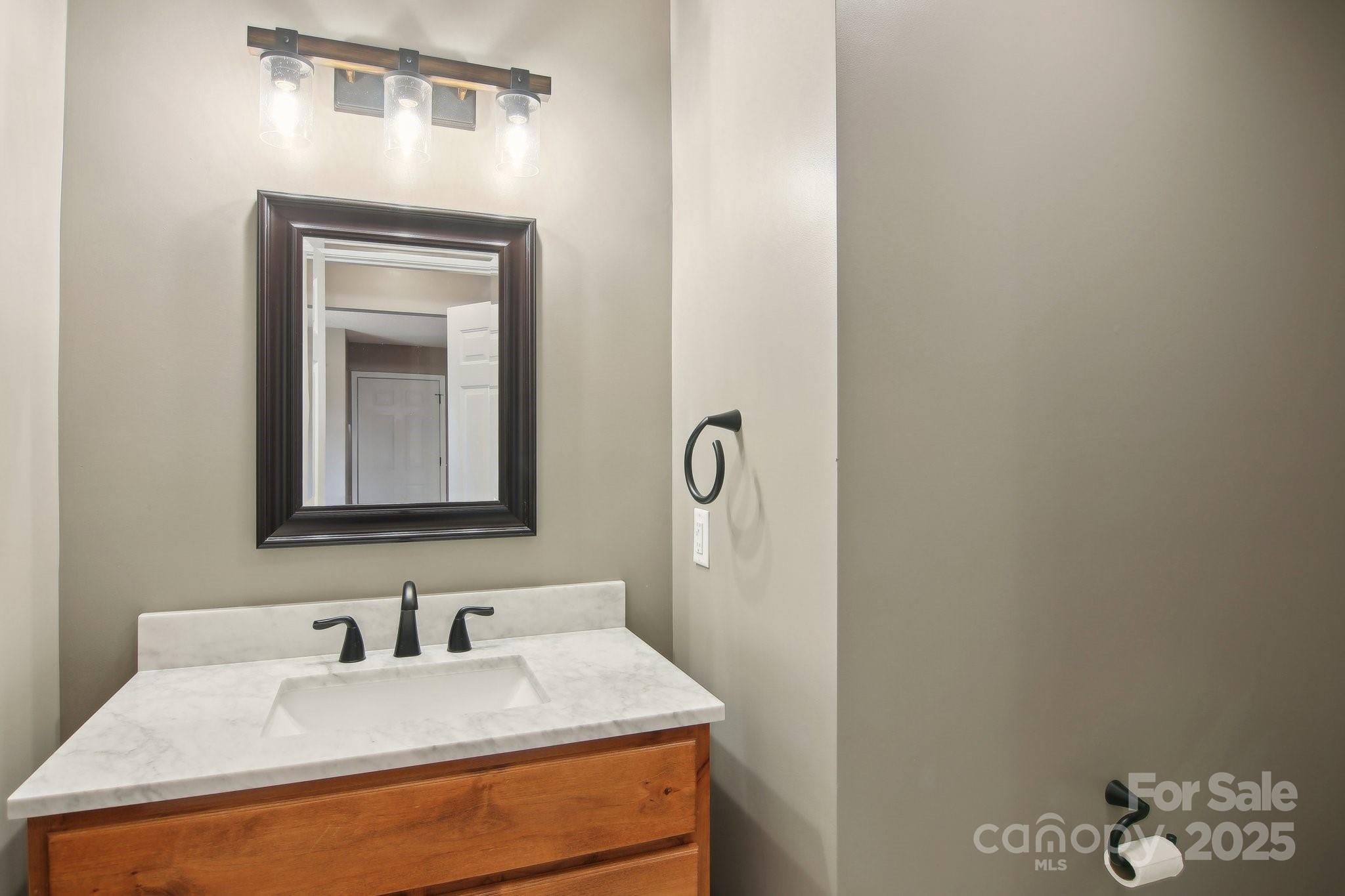 76 Eastern Sky Drive Canton, NC 28716 - Photo 24 of 48 a bathroom with a sink and a mirror