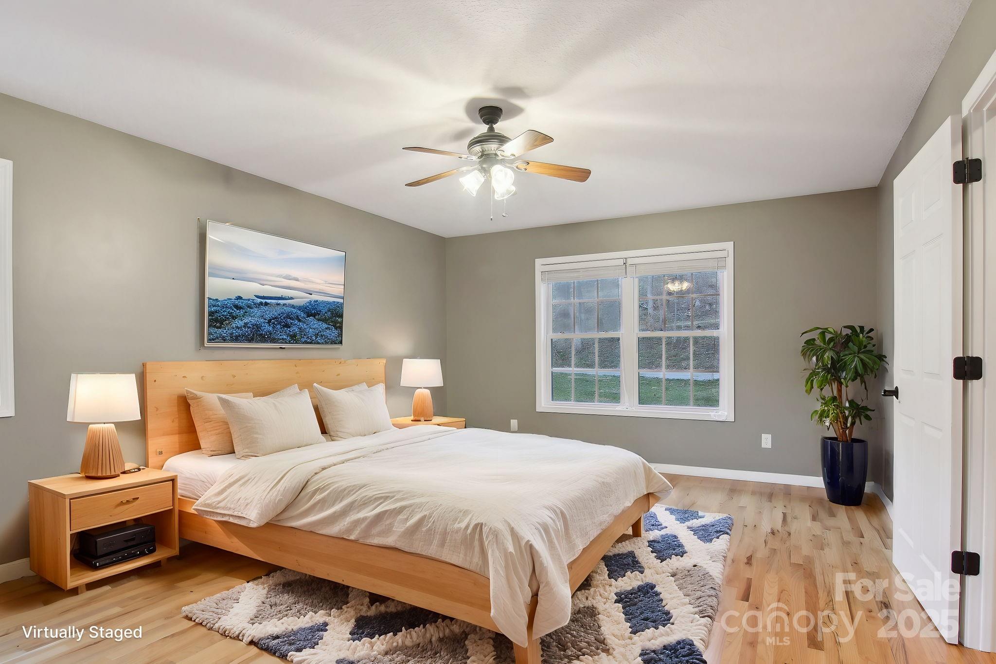 76 Eastern Sky Drive Canton, NC 28716 - Photo 25 of 48 a bedroom with a large bed and a window