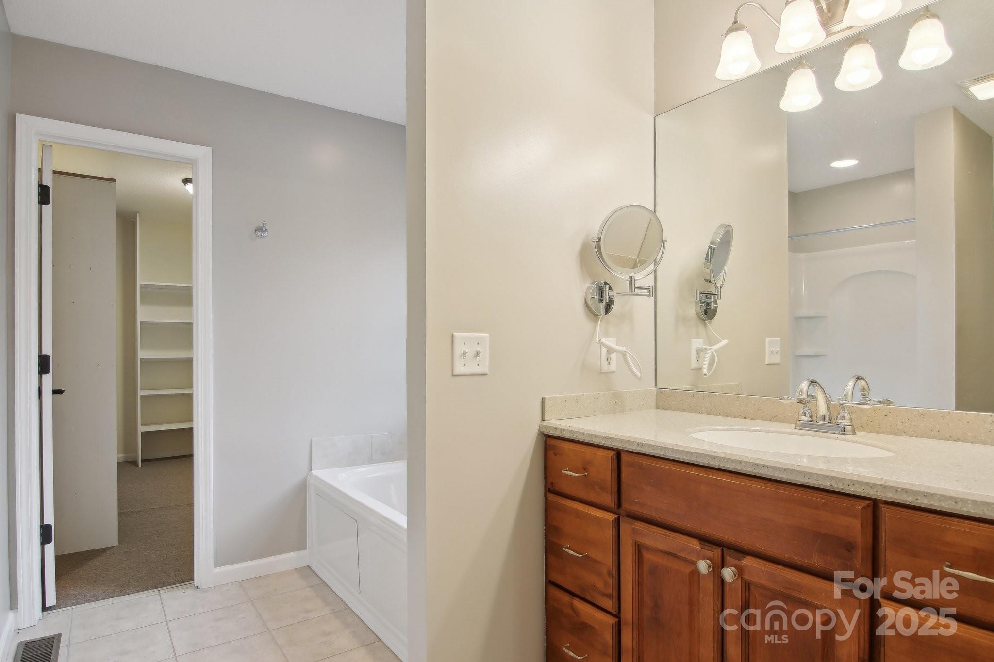 76 Eastern Sky Drive Canton, NC 28716 - Photo 28 of 48 a bathroom with a sink and a mirror