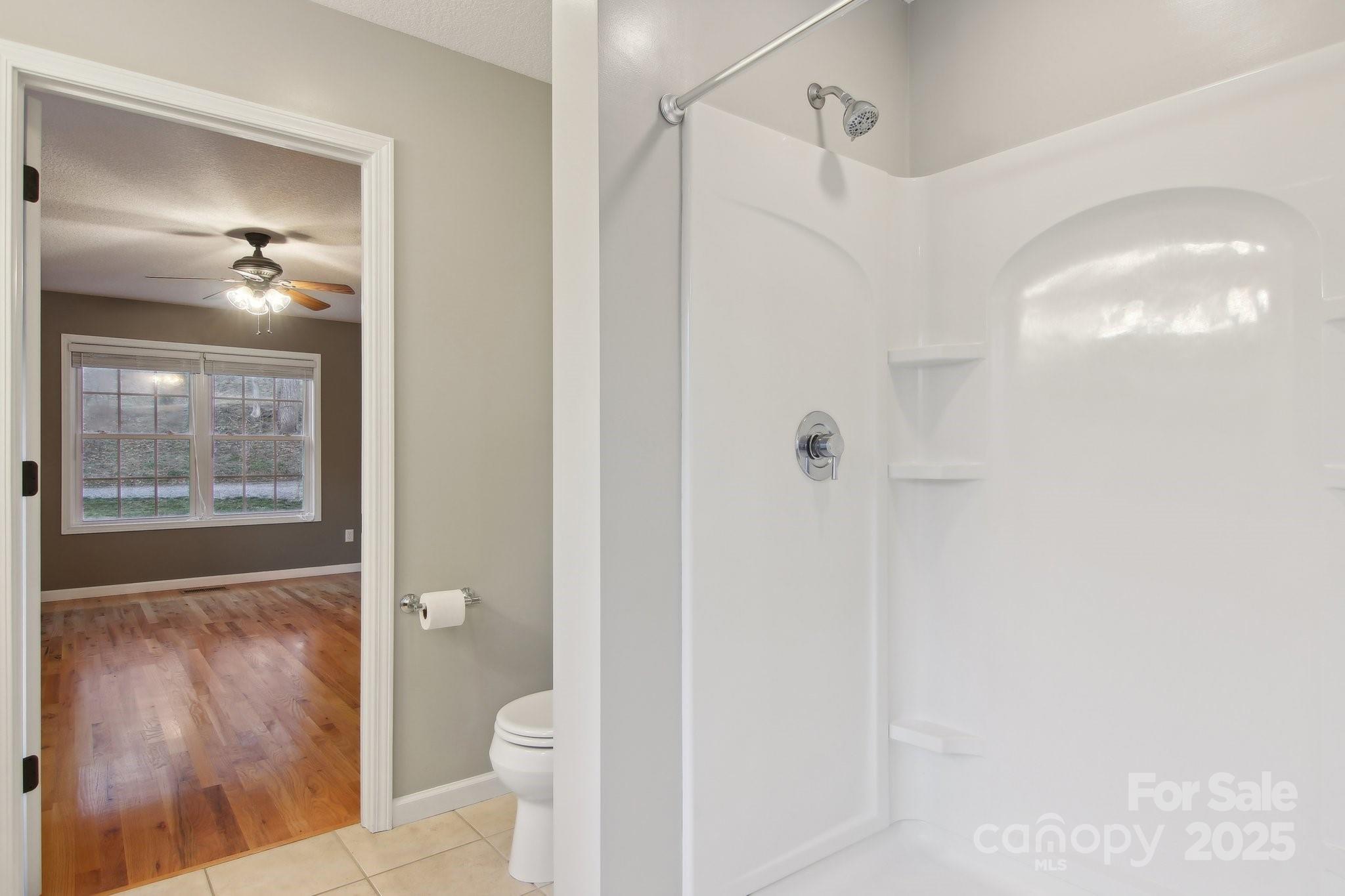 76 Eastern Sky Drive Canton, NC 28716 - Photo 29 of 48 a bathroom with a shower and a toilet