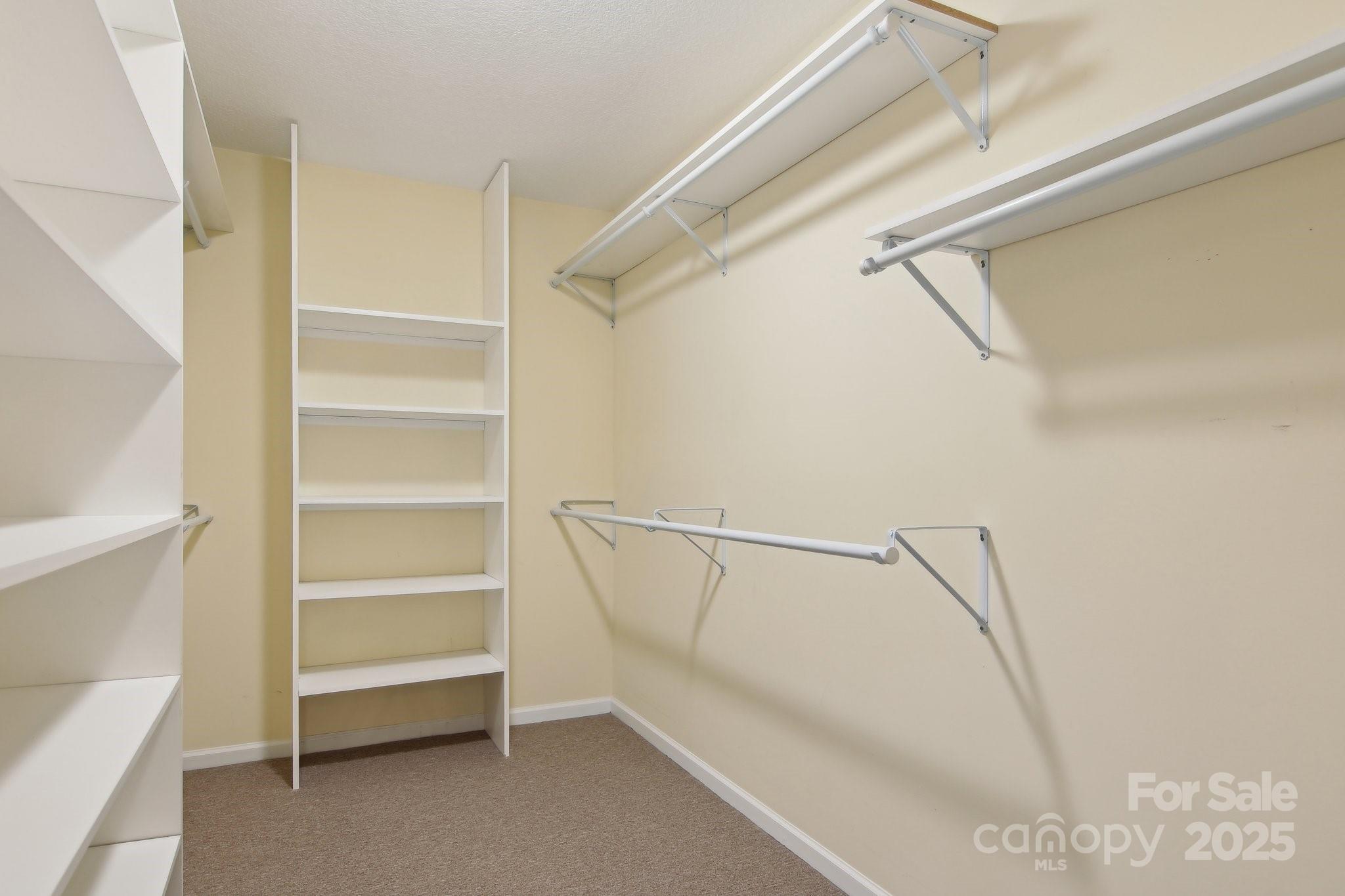 76 Eastern Sky Drive Canton, NC 28716 - Photo 30 of 48 a view of walk in closet with empty racks