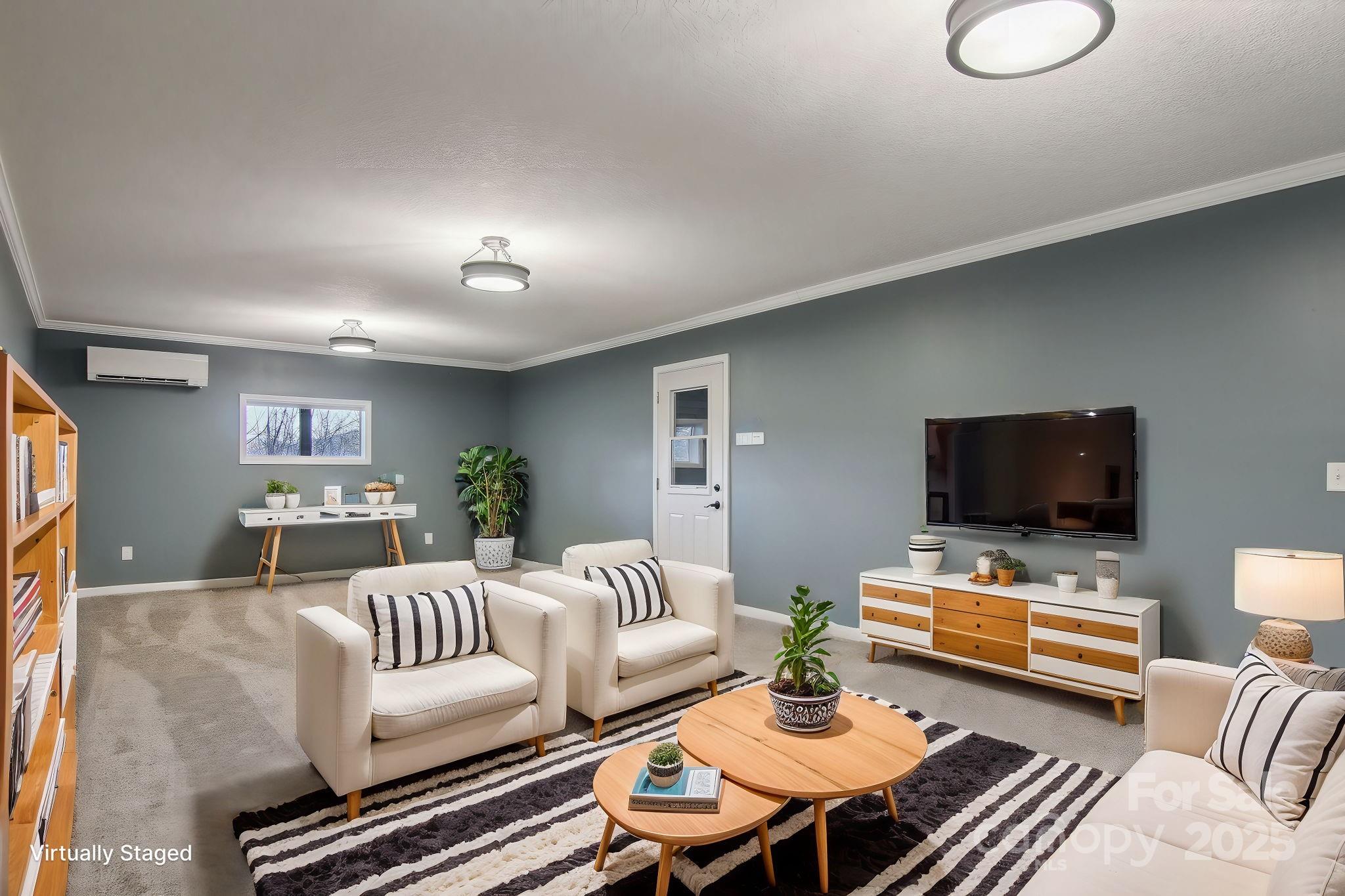 76 Eastern Sky Drive Canton, NC 28716 - Photo 37 of 48 a living room with furniture and a flat screen tv