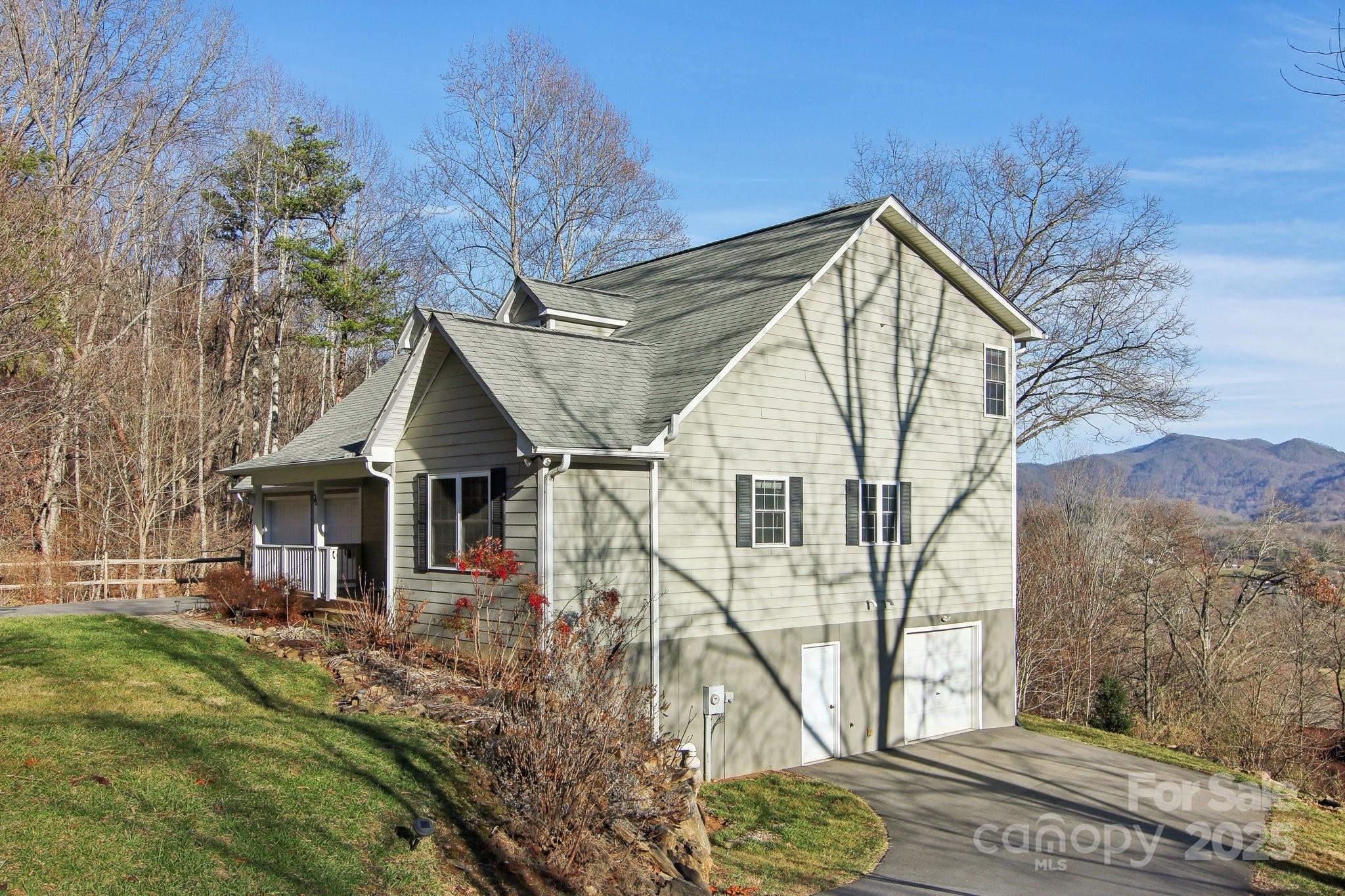 76 Eastern Sky Drive Canton, NC 28716 - Photo 4 of 48 a front view of a house with garden