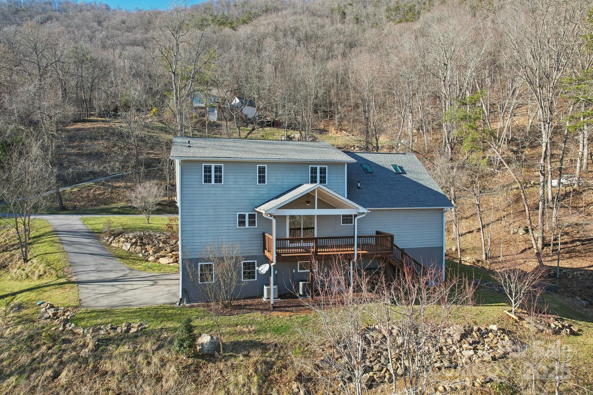 76 Eastern Sky Drive Canton, NC 28716 - Photo 6 of 48 a view of a chair and table in the patio and a yard
