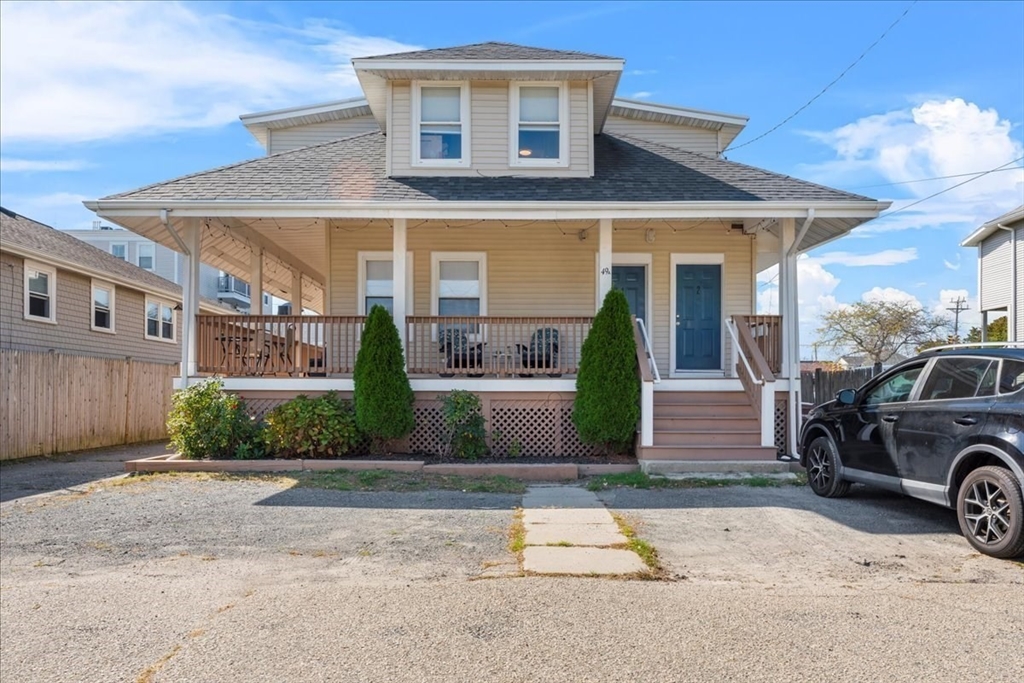 49 A Massasoit Avenue, Unit 2 Hull, MA 02045 - Photo 1 of 19 a front view of a house with a yard and garage