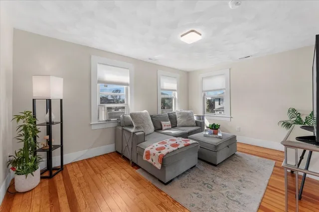 a bedroom with a bed and a potted plant