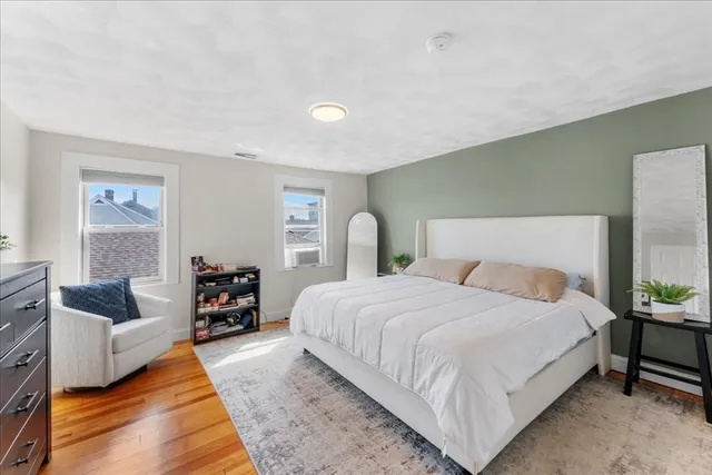 a bedroom with bed and a couch