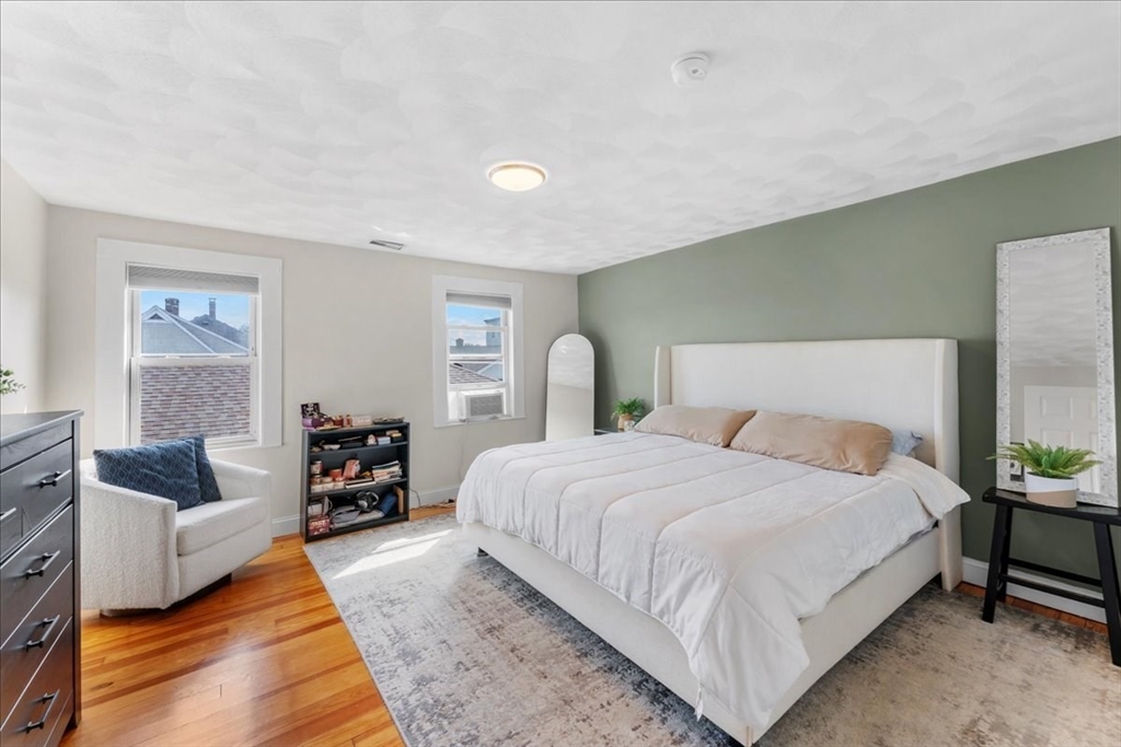 49 A Massasoit Avenue, Unit 2 Hull, MA 02045 - Photo 8 of 19 a bedroom with bed and a couch