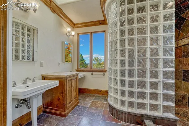 a view of a bathroom with a sink and a mirror