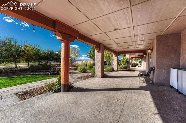 a porch with yard and outdoor seating