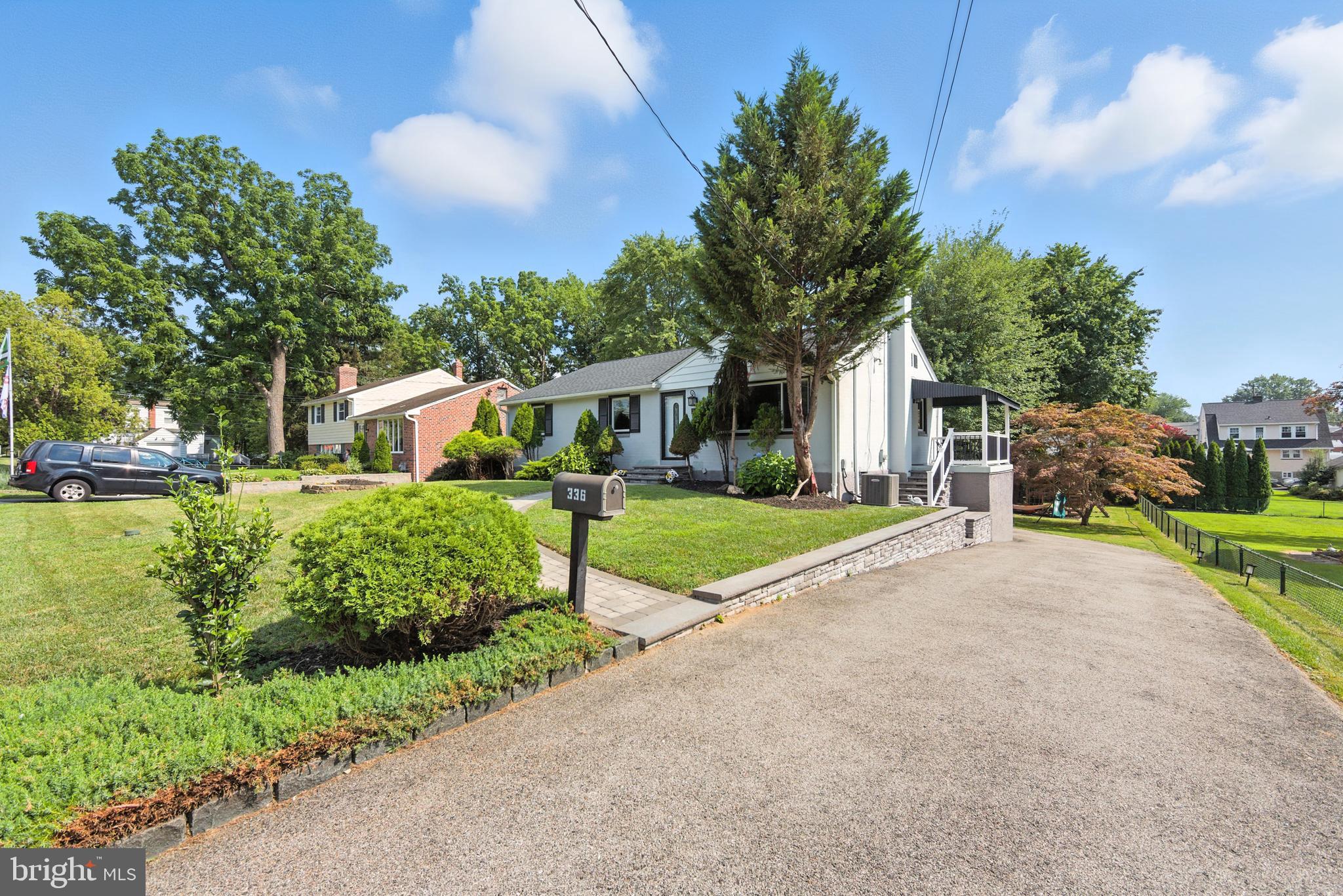 336 Kent Road Springfield, PA 19064 - Photo 11 of 36 a front view of a house with garden