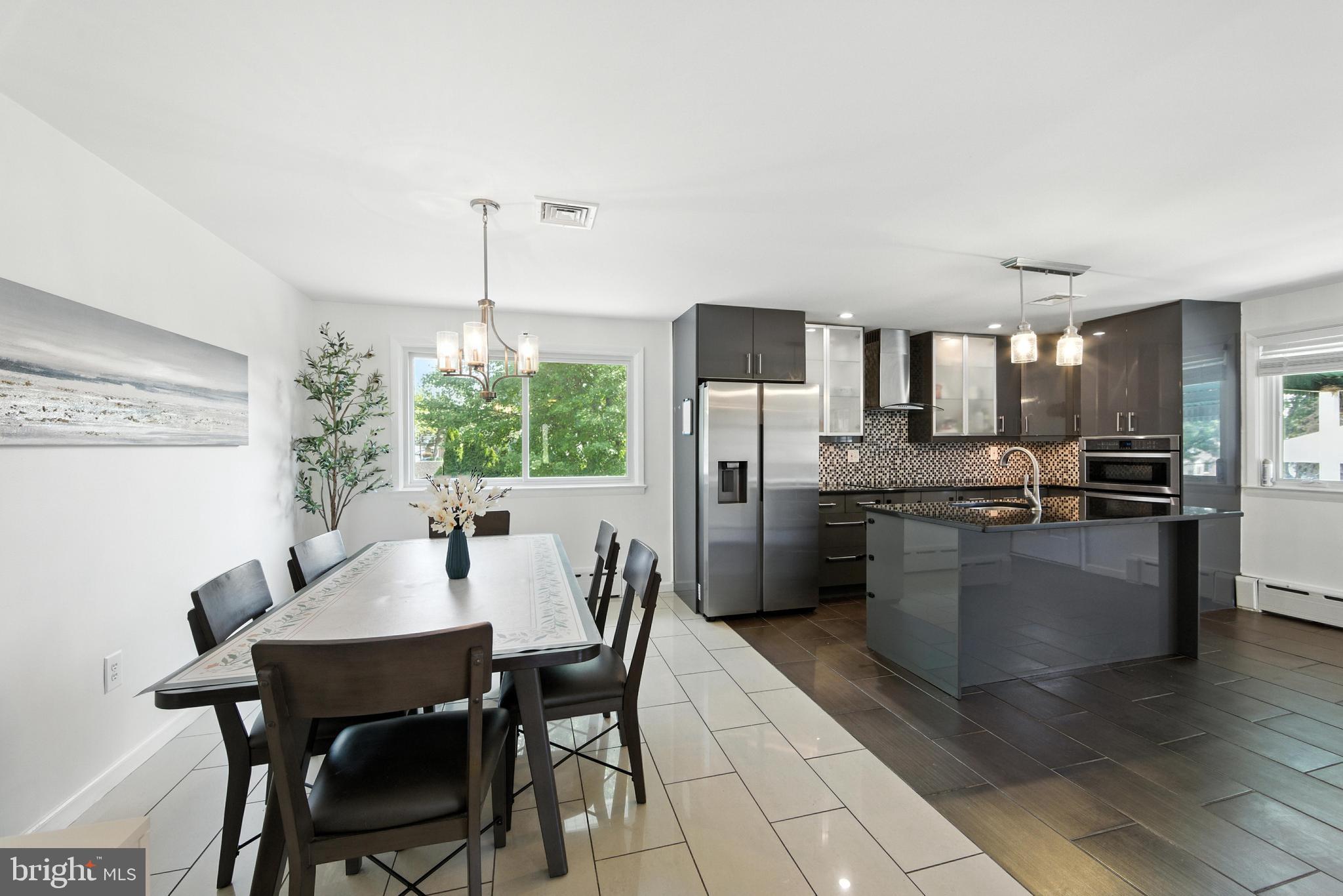 336 Kent Road Springfield, PA 19064 - Photo 27 of 36 a kitchen with a table and chairs in it