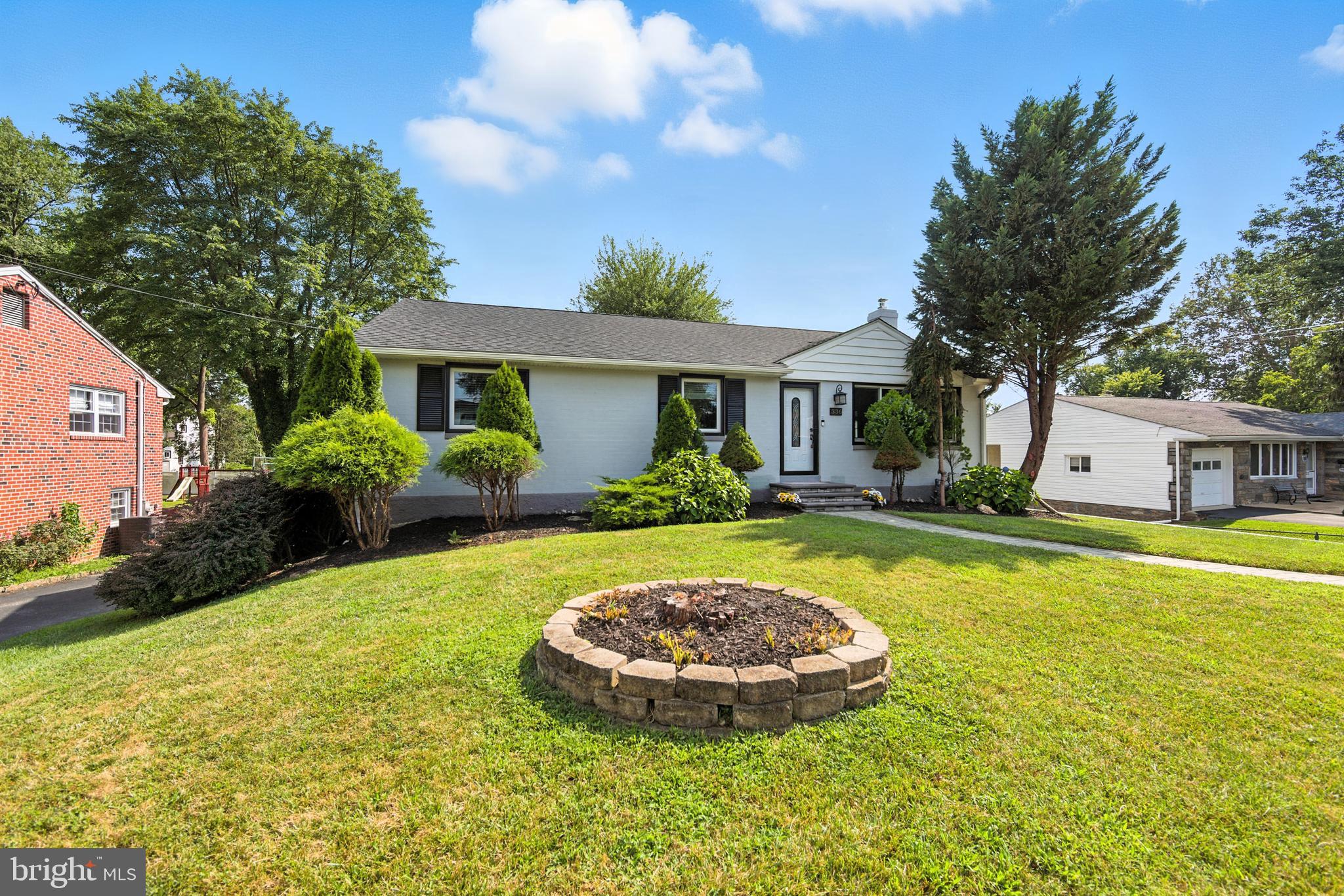 336 Kent Road Springfield, PA 19064 - Photo 3 of 36 a view of a house with swimming pool and a yard