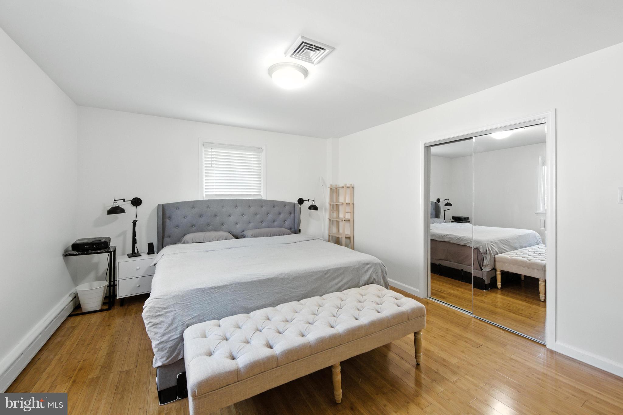 336 Kent Road Springfield, PA 19064 - Photo 33 of 36 a bedroom with a bed and wooden floor