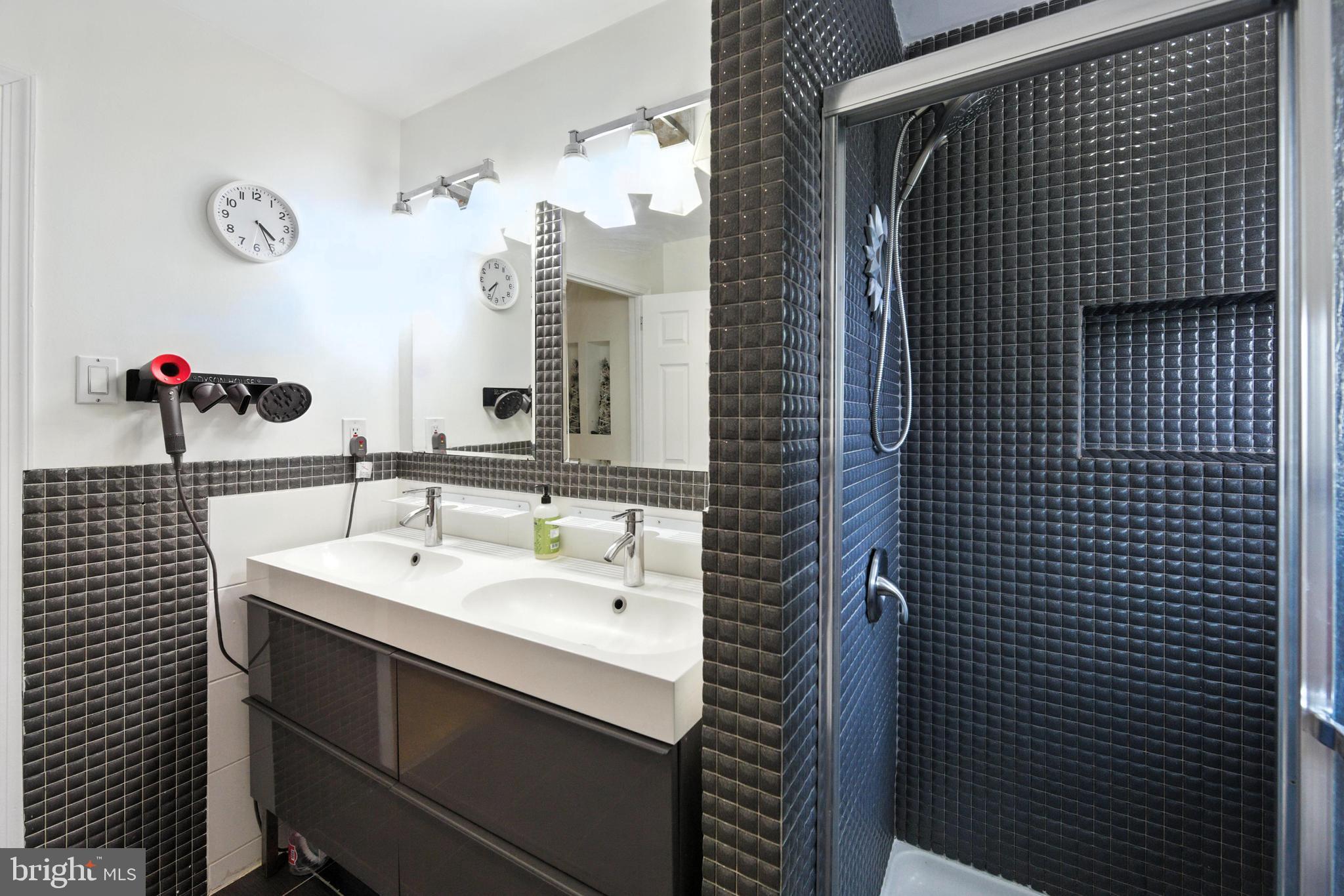 336 Kent Road Springfield, PA 19064 - Photo 36 of 36 a bathroom with a sink and a mirror