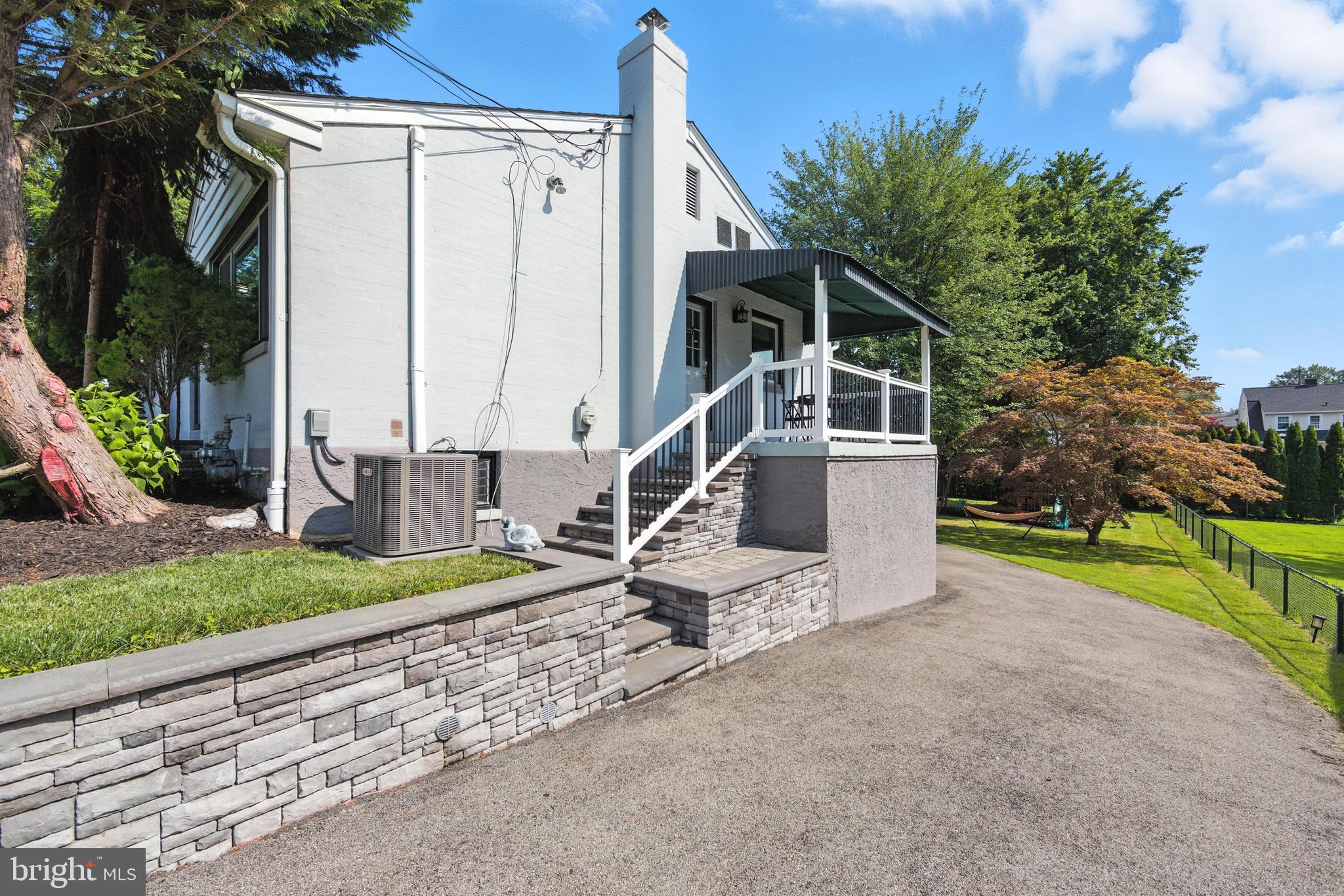 336 Kent Road Springfield, PA 19064 - Photo 4 of 36 a view of a house with backyard and trees