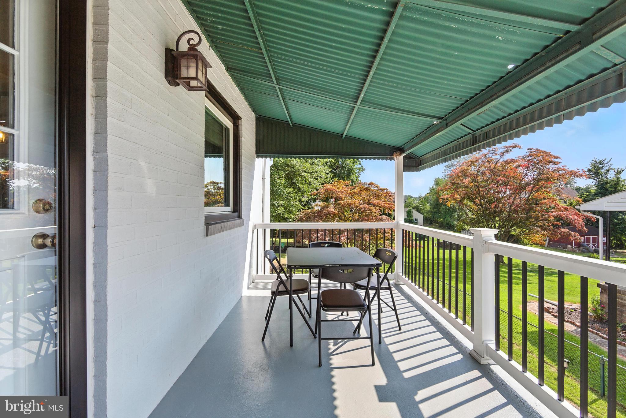 336 Kent Road Springfield, PA 19064 - Photo 5 of 36 a view of a chairs and table in the balcony
