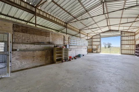 a view of an empty room with a garage