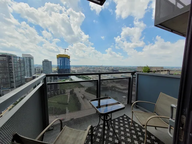 a terrace with outdoor seating and city view
