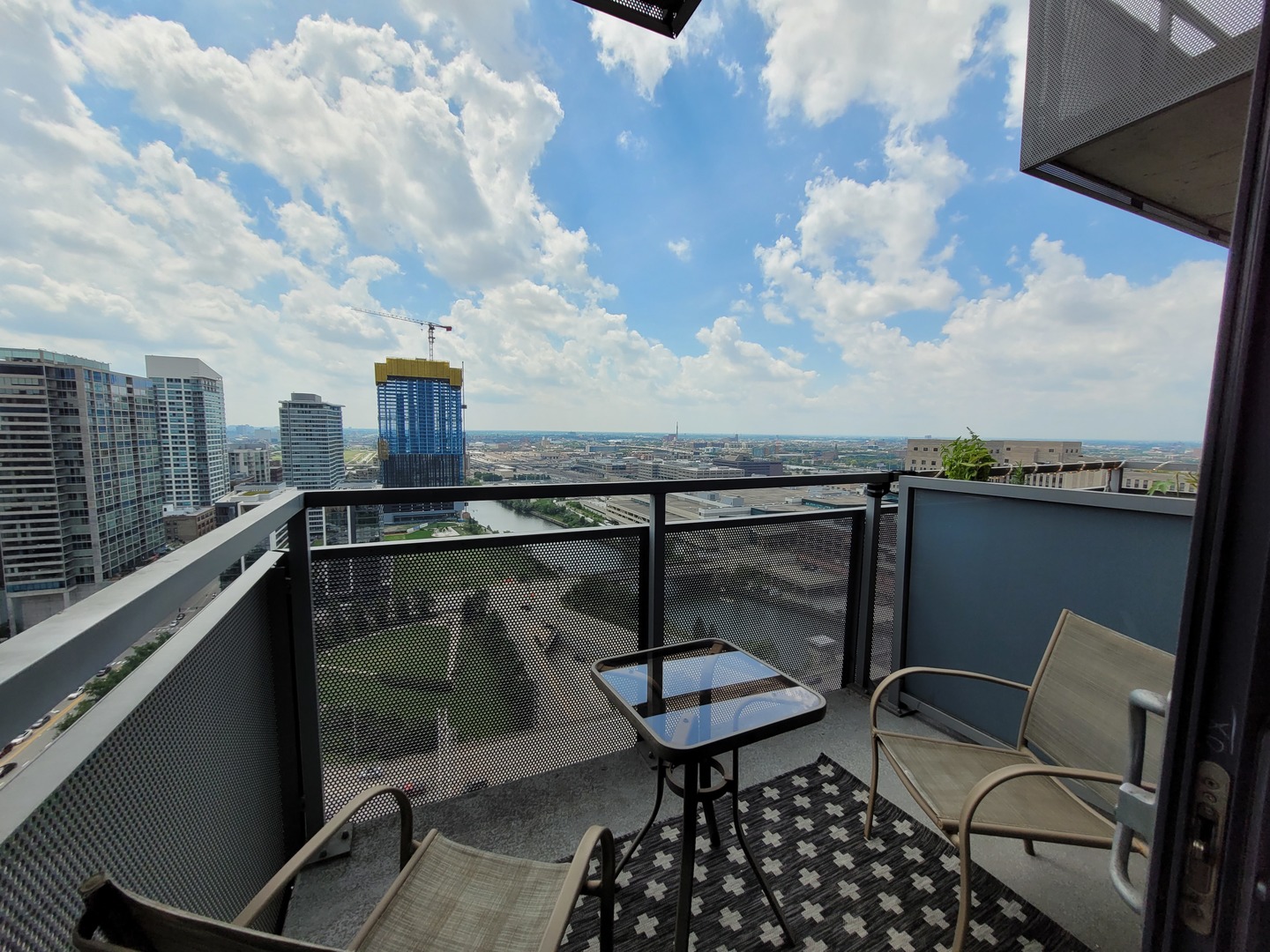 235 West Van Buren Street, Unit 2608 Chicago, IL 60607 - Photo 15 of 20 a terrace with outdoor seating and city view