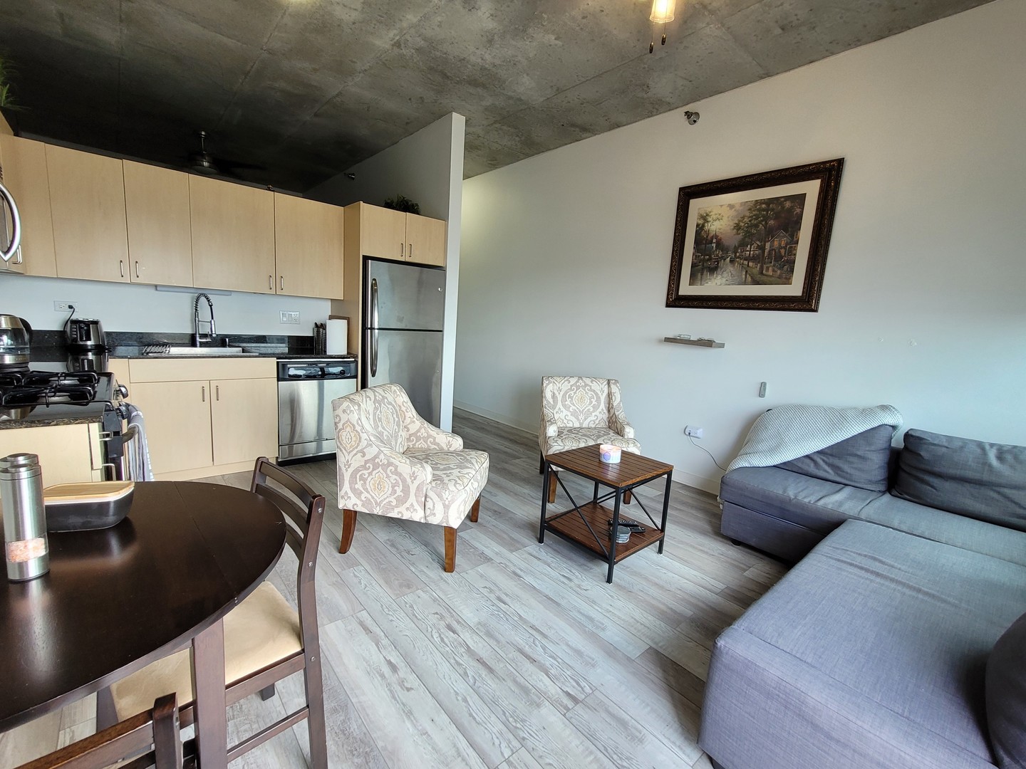 235 West Van Buren Street, Unit 2608 Chicago, IL 60607 - Photo 5 of 20 a living room with furniture and kitchen view