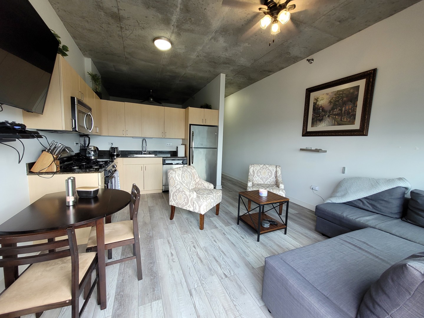 235 West Van Buren Street, Unit 2608 Chicago, IL 60607 - Photo 7 of 20 a living room with furniture and wooden floor