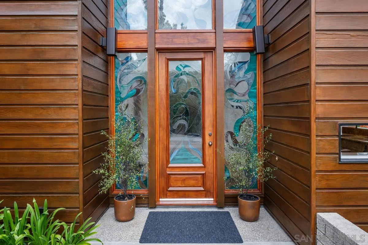 14430 Rancho Santa Fe Farms Road Rancho Santa Fe, CA 92067 - Photo 13 of 51 a view of a door with a potted plant